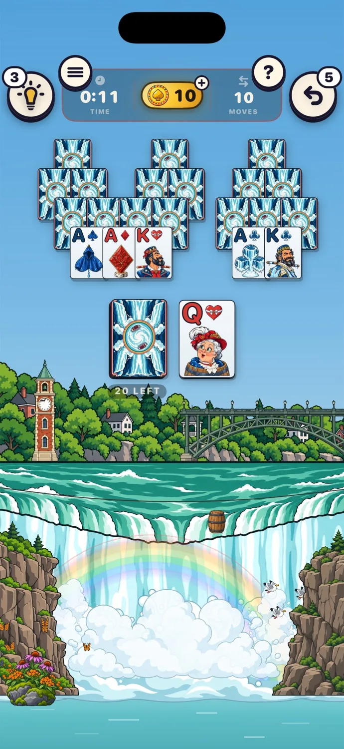 A game of TriPeaks on the Niagara Falls table, with a rainbow over the falls and a deck painted for Niagara.