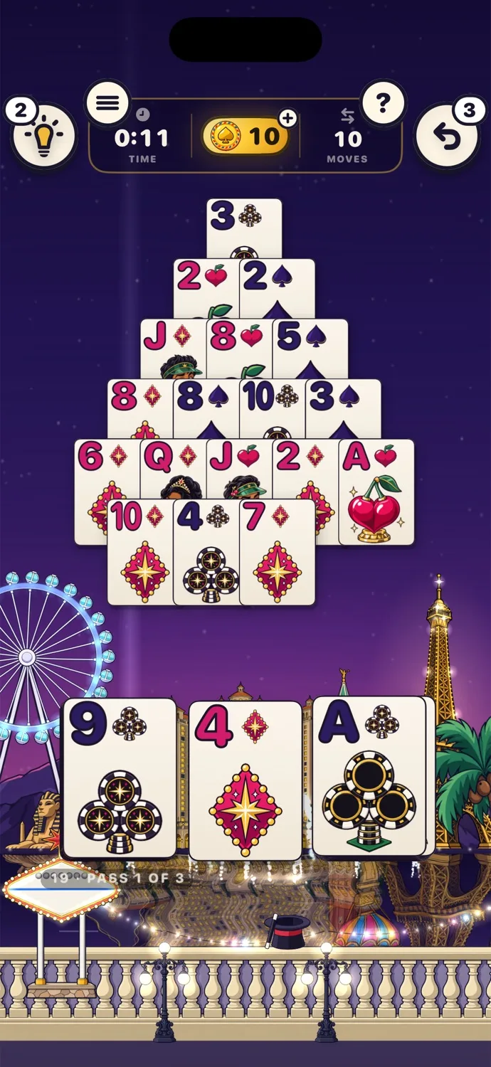 A game of Pyramid on the Las Vegas table at night, with a big wheel and the lights of the Strip, and a deck painted for Las Vegas.